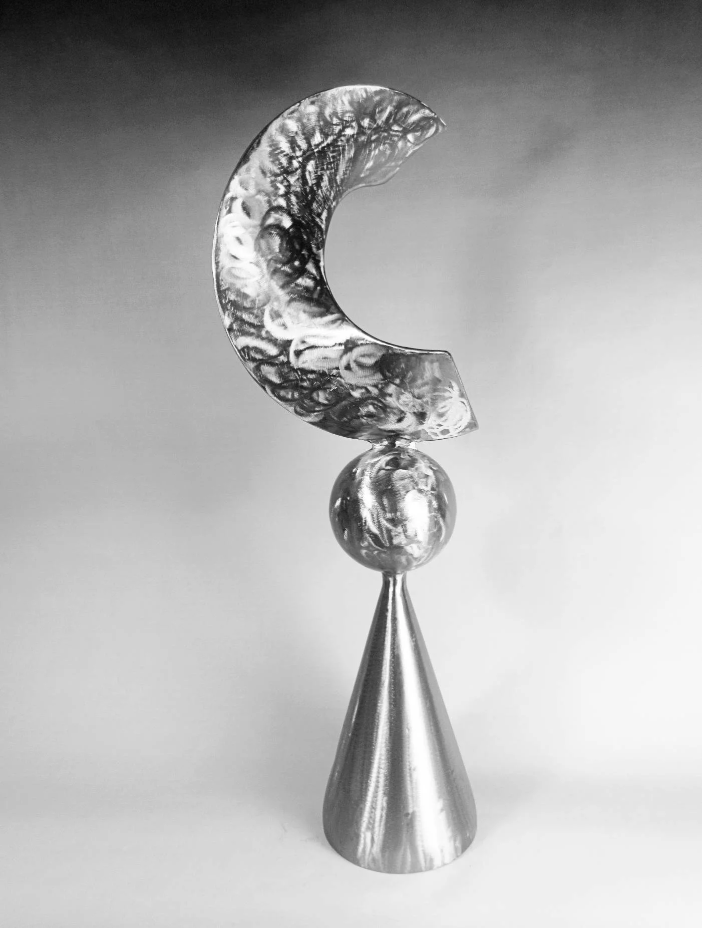 Cone Series sculpture by Michael Herold featuring a crescent-shaped steel form balanced above a sphere and cone foundation, designed as a monumental public art concept for architectural settings, civic plazas, hospitality projects, and large-scale developments.